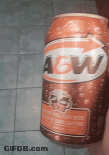 A Can Of A&w Root Beer Is Being Held By Someone GIF
