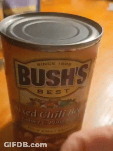 A Can Of Bush 'S Best Mixed Chili Beans Is On A Table GIF