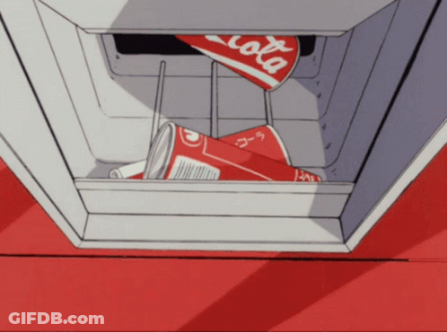A Can Of Coca Cola Is Sitting In A Cooler GIF