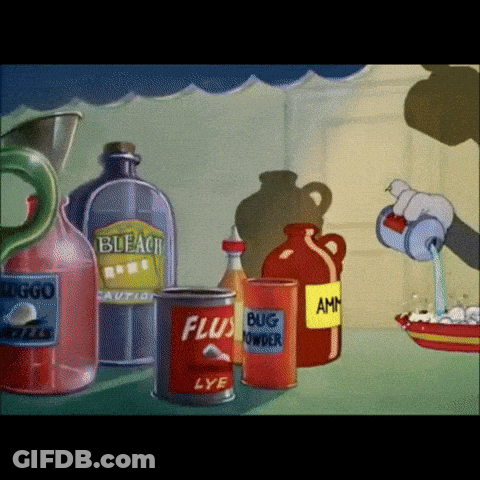 A Can Of Flusy Lye Sits On A Table Next To A Jug Of Bleach GIF