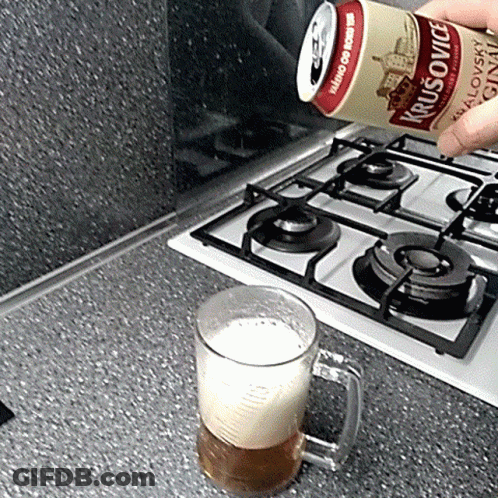A Can Of Krusovice Is Poured Into A Glass GIF