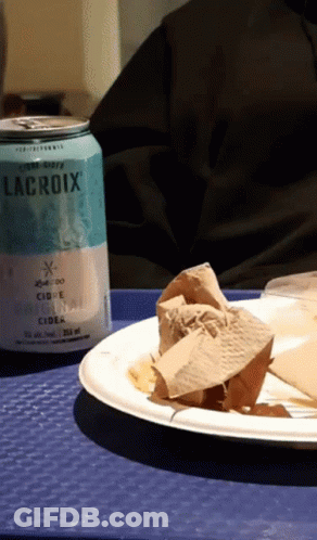 A Can Of Lacroix Cider Sits Next To A Paper Plate GIF