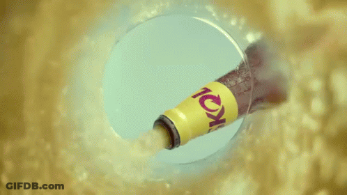 A Can Of Skol Sits On A Table Next To A Glass Of Skol GIF