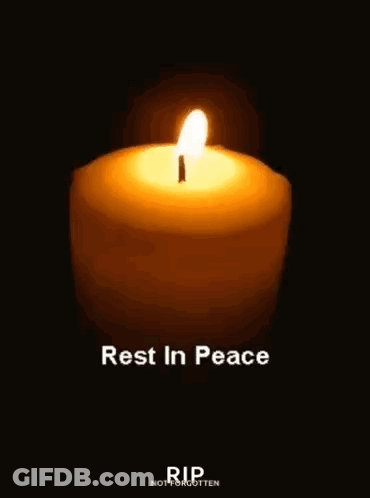 A Candle Is Lit In The Dark With The Words `` Rest In Peace '' Written Below It . GIF