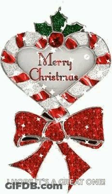 A Candy Cane In The Shape Of A Heart With A Bow And Holly On It . GIF