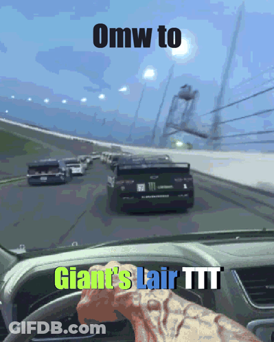 A Car Driving Down A Road With The Words Omw To Giant 'S Lair Ttt On The Dashboard GIF