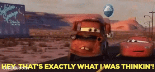 A Car From The Movie Cars Is Driving Down A Road With A Balloon Flying In The Background . GIF