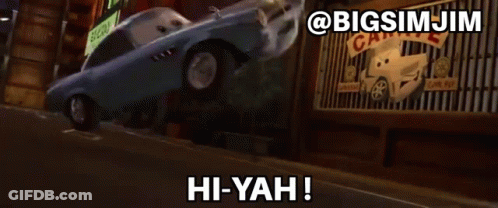 A Car From The Movie Cars Says Hi-Yah In Front Of A Garage GIF