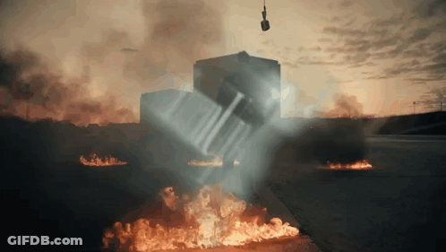 A Car Is Being Lifted Into The Air By A Crane GIF