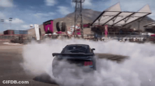 A Car Is Drifting In A Video Game And Smoke Is Coming Out Of It GIF