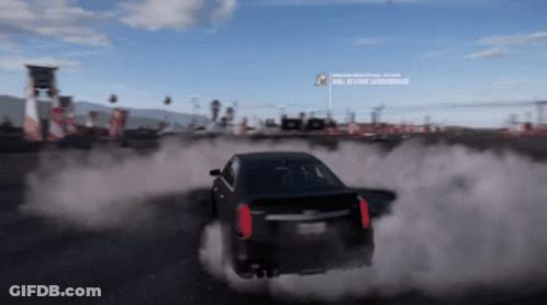 A Car Is Drifting In A Video Game With A Sign That Says " Roll Of Fame " On It GIF