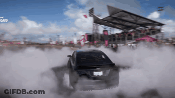 A Car Is Drifting In Front Of A Crowd And The Word Board Is Visible In The Background GIF