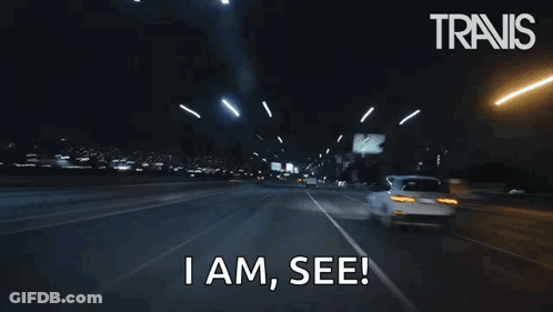 A Car Is Driving Down A Highway At Night And Says I Am See . GIF