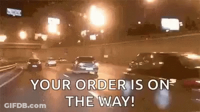 A Car Is Driving Down A Highway At Night And Says `` Your Order Is On The Way ! '' GIF