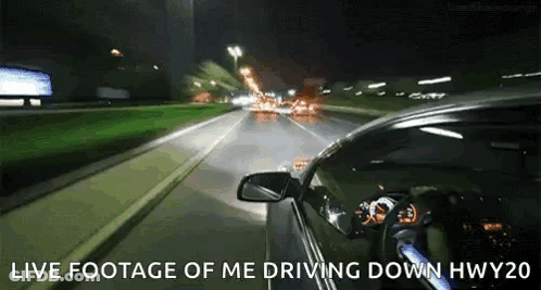 A Car Is Driving Down A Highway At Night With The Words Live Footage Of Me Driving Down Hwy20 Above It GIF