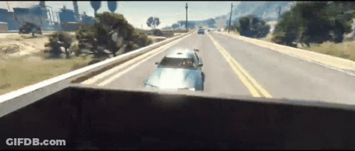 A Car Is Driving Down A Highway In A Video Game .. GIF