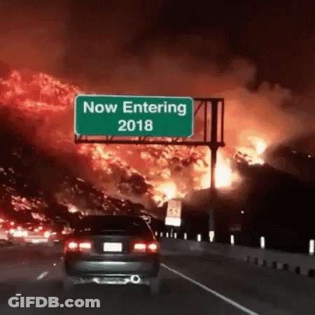 A Car Is Driving Down A Highway In Front Of A Sign That Says Now Entering 2018 GIF