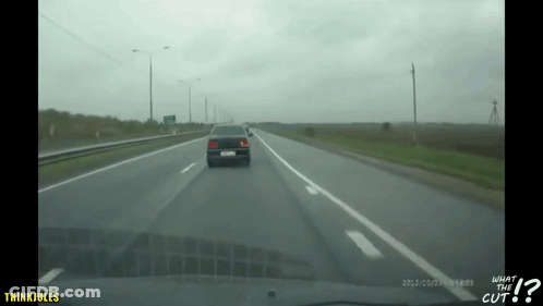 A Car Is Driving Down A Highway With The Words What The Cut On The Bottom Right GIF