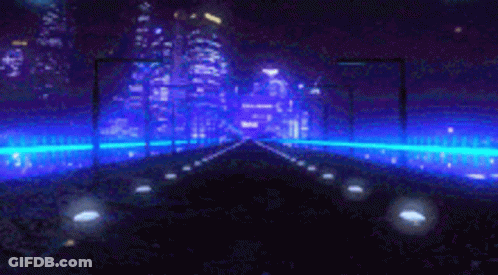 A Car Is Driving Down A Road At Night With A City In The Background . GIF