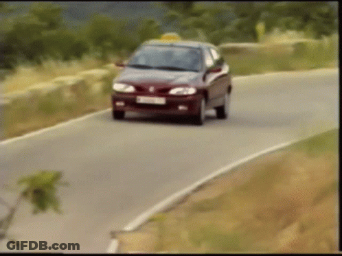 A Car Is Driving Down A Road With A License Plate That Says ' Tc ' On It GIF
