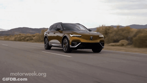 A Car Is Driving Down A Road With A Motorweek.org Logo In The Corner GIF