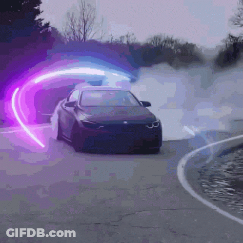 A Car Is Driving Down A Road With A Purple Light Behind It GIF