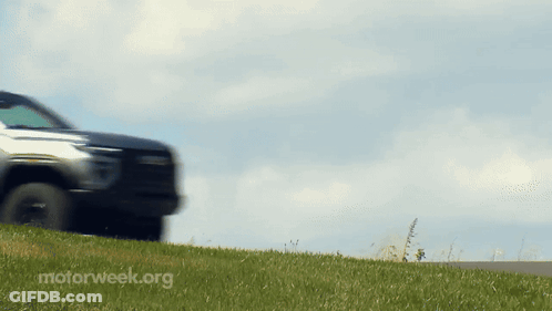 A Car Is Driving Down A Road With Motorweek.org Written On The Bottom Right GIF