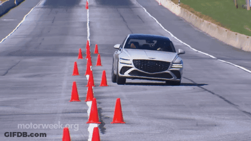 A Car Is Driving Down A Road With Motorweek.org Written On The Bottom Right GIF