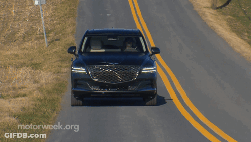 A Car Is Driving Down A Road With Motorweek.org Written On The Bottom Right GIF