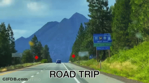 A Car Is Driving Down A Road With The Words Road Trip Below It GIF
