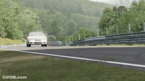 A Car Is Driving Down A Road With Trees On The Side GIF