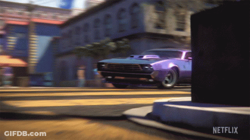 A Car Is Driving Down A Street With Netflix Written On The Bottom GIF