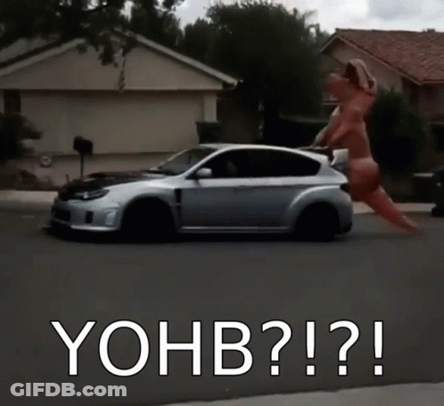 A Car Is Driving Down A Street With The Words Yohb Written On The Bottom GIF