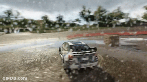 A Car Is Driving Through A Puddle Of Water On A Rainy Day GIF