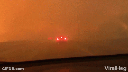 A Car Is Driving Through A Smokey Area With The Words Viralhog Written On The Bottom GIF