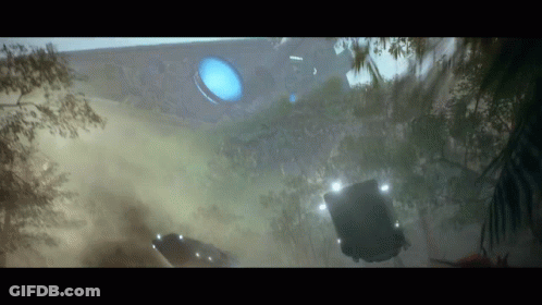 A Car Is Flying Through The Air In Front Of A Building . GIF