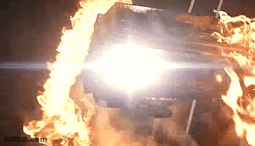 A Car Is On Fire With A Bright Light Coming Out Of The Hood GIF