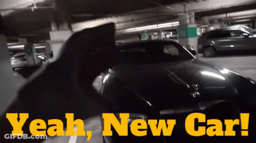 A Car Is Parked In A Parking Garage With The Words " Yeah New Car " Above It GIF