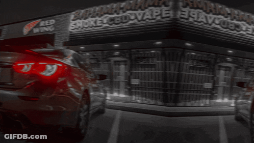A Car Is Parked In Front Of A Store Called Bahamas Smoke Cbd Vape GIF