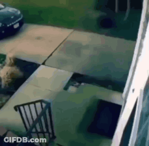 A Car Is Parked On The Side Of The Road Next To A Staircase GIF
