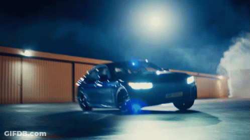 A Car That Has A License Plate That Says ' Aa ' On It Is Driving Down A Road GIF
