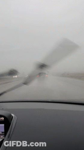A Car Windshield Wiper Is Being Used To Clean The Windshield Of A Car GIF