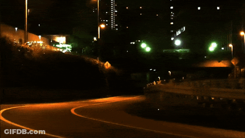 A Car With A License Plate That Says ' A ' On It Is Driving Down A Dark Street GIF