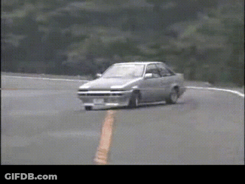 A Car With A License Plate That Says ' A ' On It Is Driving Down A Road GIF