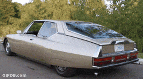 A Car With A License Plate That Says ' Nc ' On It Is Parked On The Side Of The Road GIF