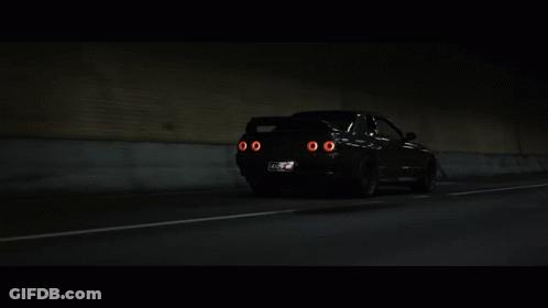 A Car With A License Plate That Says ' Nz ' On It Is Driving Through A Tunnel GIF