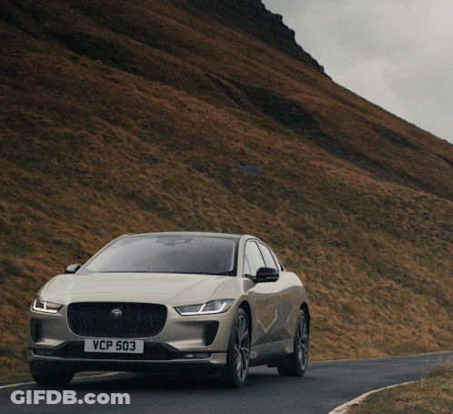 A Car With A License Plate That Says Vcp 503 Drives Down A Road GIF