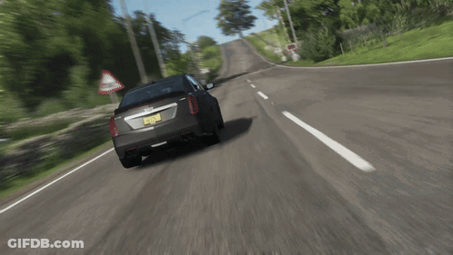 A Car With A New York License Plate Is Driving Down The Road GIF