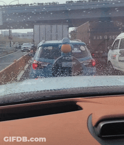 A Car With A Sticker On The Back That Says Suzuki GIF