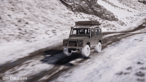 A Car With A Tent On Top Of It Is Driving On A Snowy Road GIF